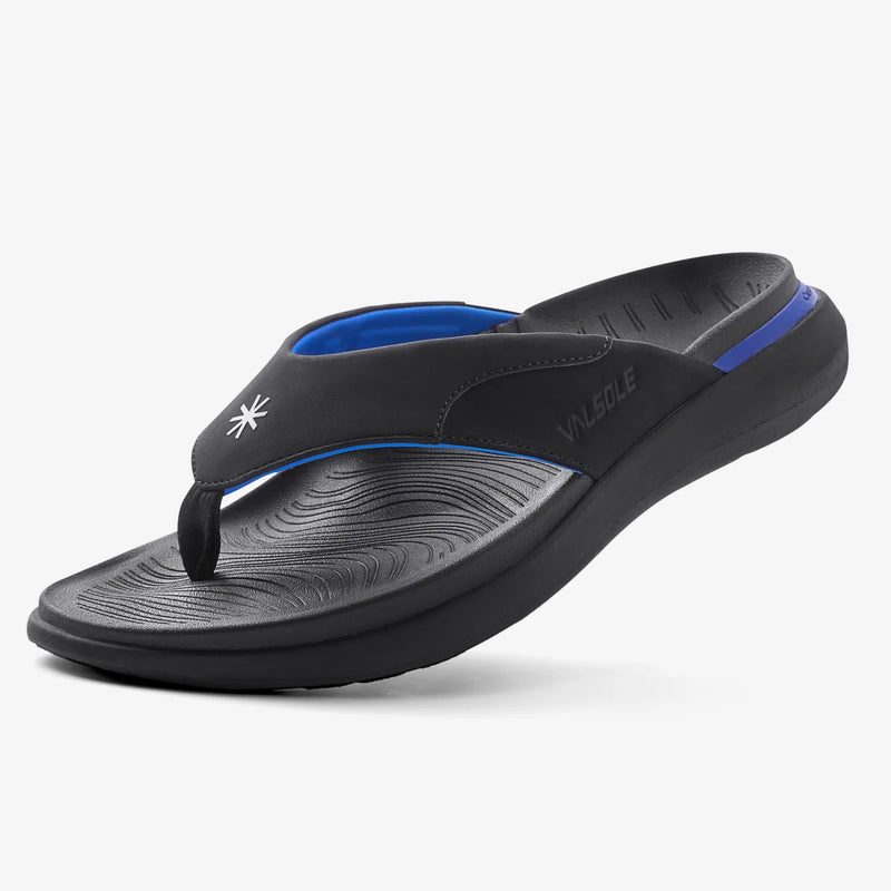 Black sandal with blue interior on a white background